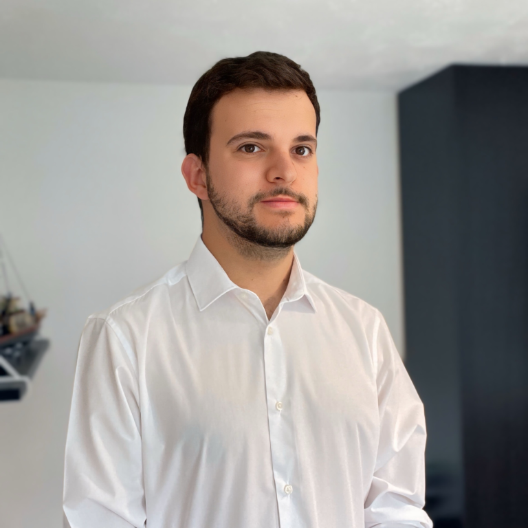 Lewis Wright in his office looking at the camera.